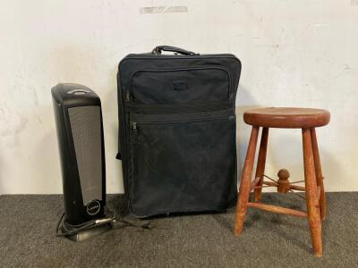 Ciao Suitcase, Lasko Space Heater, And Small Wooden Stool