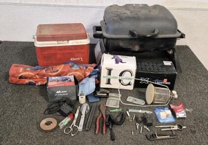 Portable Gas Grill(Unable to Test), Mini Cooler, Kids Camping Chair, Inflatable Dino Costume(Looks New), 3/4" D Ring Shackle(2), X Raxiom Lighting, Miscellaneous Tools