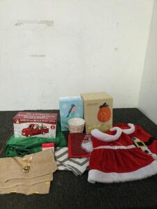 Christmas and Halloween decor including large dog Santa and Mrs. Claus outfits and table runners