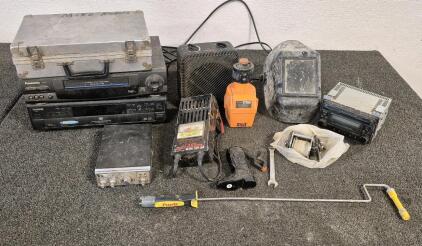 Toshiba DVD Player(Works), Panasonic VHS Player(Unable to Test), Mini Heater Fan(Works), Chicago Drill Bit Sharpener(Works), Car CD Radio(Unable to Test), 6&12V Battery Load Tester(Unable to Test), CB Radio(Unable to Test), Welders Helmet, Fishing Reels, 