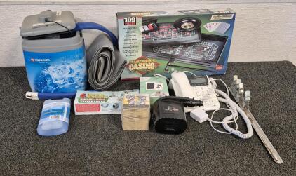 Casino Deluxe Table Game Set, Motorola House Phone(Works), Breg Polar Care Kodiak Rehab Machine (Works), Small Ice Pack, Cat Litter Liners, Pet Paw Print Pad, Coleman Inflate(Unable to Test), Oktoberfest Coasters, Rack Metal