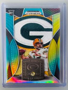 This is a Panini Prizm &ldquo;Super Bowl Champion&rdquo; Rookie Patch Relic Card featuring a Green Bay Packers Quarterback With Writing On Back