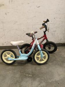 Two kids bikes one light blue on red