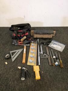 Assorted tools including screwdrivers and a stud finder