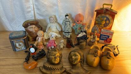 Assorted Vintage/Antique Items , Old Porcelain Dolls , 1968 Fisher Price Music Box Teaching Clock , Vintage Band Aid Tin , Wooden Clogs and More