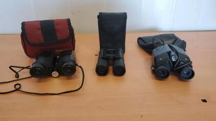(2) Nikon Binoculars (1) Bushnell Binoculars With Cases