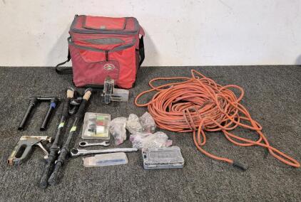 Extension Cord, Hyper Tough Case with Some Stubby Driver Pieces, Wrench, Ryobi EZ Clean Power Cleaner Nozzle Kit, Tile Cutter, Stapler, Walking Sticks, Arctic Zone Lunch Bag, Other Miscellaneous Tools