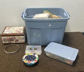 (1) Tote of Cross Stitch Frames, thread, and more. (1) sewing box with thread and needle. (1) Thread holder and pin cushion and more.