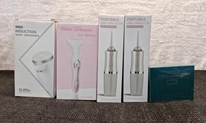 (1) Cordless Soap Dispenser, (1) Women's Cordless Bikini Trimmer, (2) Cordless Oral Irrigators & (1) Electric Nail Clipper