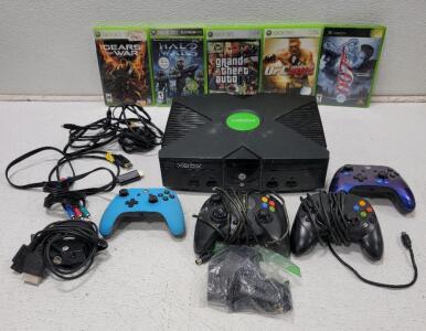 (1) Xbox (1) Universal RF Adapter (2) Wired Controllers (2) Wireless Controllers (5) Games