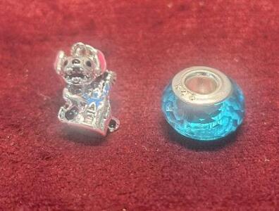 (1) 2-Piece Pandora Charm Set, (1) Stich & The Tower Of Terror & (1) Blue Faceted Glass Bead