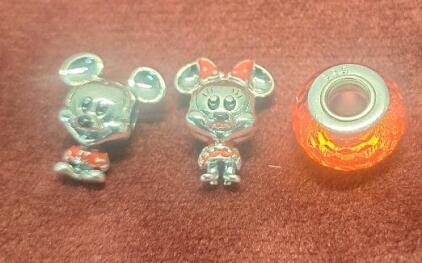 (1) 3-Piece Pandora Charm Set, (1) Micky Mouse, (1) Minnie Mouse & (1) Red Faceted Glass Bead