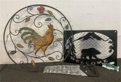 Metal Decor Including Rooster, Bear Welcome Sign, Decorative Saw, And Small Fish Sign