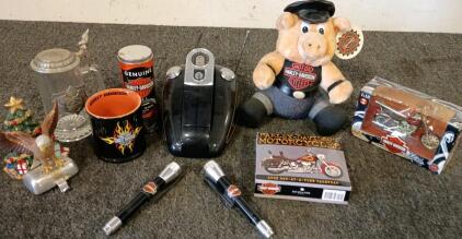 Lot of Harley-Davidson Collectibles Including FXDWG DYNA Wide-Glide Motorcycle Figurine, Harley Davidson Stuffed Pig, Harley Davidson Collectible Calendar, (2) Harley Davidson Flash Lights, (2) Harley Davidson Collectible Mugs, Harley-Davidson Cordless Te