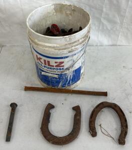 Bucket of Horseshoes & Several Metal Stakes