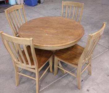 A 42"x 42"x 29&frac12;" Wooden Table w/ a Foldable Hide-a-Leaf Inside & (4) Matching Wooden Chairs