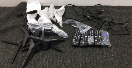 Various TV Remotes, Cords, and Stands