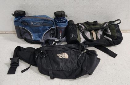 (1) North Face Multi Bottle Sling (1) Outdoor Products H2O Mojave Waist Pack (1) Eddie Bauer Hydration Twin Bottle Pack