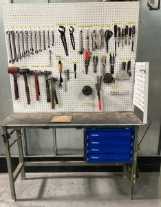 Tool bench with pegboard and tools