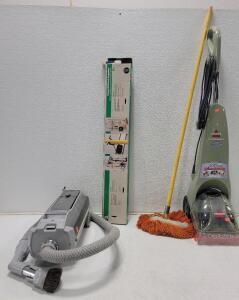 (1) Bissell QuickSteamer (1)Electrolux Silverado Deluxe Canister Vacuum Cleaner (1) Clamps Wall Rack Organizer (1) Dust Mop