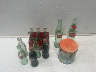 (13) Coca-Cola bottles and (1) cola Puzzle.