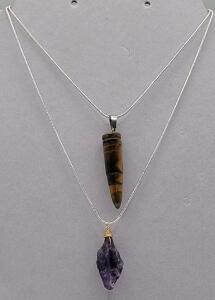 (1) Bullet Shaped Tiger-Eye Necklace on a .925 chain (1) Uncut Amethyst Crystal on a .925 chain