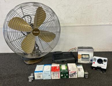 (1) Garmin Lifetime Maps, (1) Polaroid Camera, (1) Electric Fan, And More