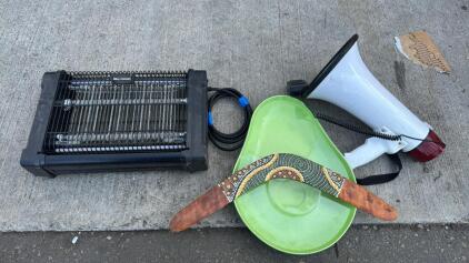 (1) Bell Howell Bug Zapper (1) Mega Phone (1) Decorative Boomerang (1) Avacodo Shaped Chip N Dip Tray