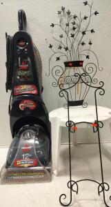 BISSELL ProHeat 2X Revolution Pet Turbo Upright Carpet Cleaner. Wall decor and small table