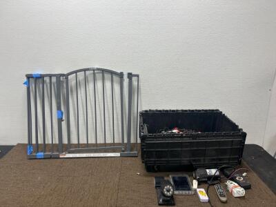 (1) Tote with bunker hill Security device, Solar powered outdoor light, and more (1) Dog gate.