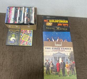 (20) DVD Movies including Pitch Perfect movies and the nightmare before Christmas (5) Vynl records.
