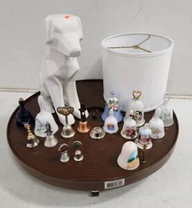 (1) 24" Rolling Plant Dolly (1) Winslow Porcelain Dog (1) Circular Lamp Shade And Assorted Collectable Bells