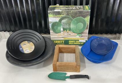 (1) Garrett Gravity Trap Gold Panning Kit (4)Various Size Gold Pans (1)Shifter Pan (1)Dirt Shovel
