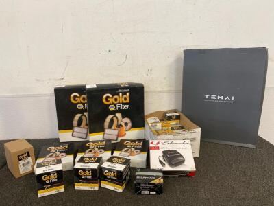 Box Of New NAPA Gold Fuel Filters, (9) Various Air Filters, Tesla Sun Shade, Ceramic Heater And Fan