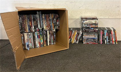 (1) Box Filled With Various DVD Movies- Including Dumb And Dumber, Chicken Little, The Breakfast Club, And More