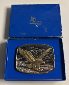 International Monetary Mint American Eagle Belt Buckle .It is crafted from fine silver plate and accented with a layer of genuine 24k gold.
