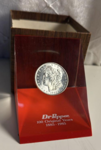 Dr. Pepper 100 Original Years Commemorative 1885 Morgan Silver Dollar Paperweight