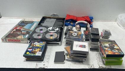 (1) Radio shack golf game. (21) CDs Including The Beatles (8) Xbox and Play Station games Including Bolt, GTA, and thunder strike and more