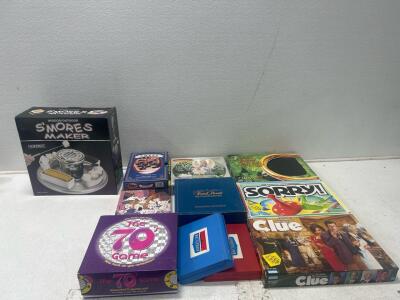 (8) Board games including clue, sorry, and The 70&rsquo;s game. (2) Puzzles (1) Indoor/outdoor S&rsquo;mores maker.