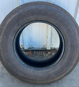 (4) 17&rdquo; Bridgestone Tires Dueler H/T 684II (Located in The Yard)