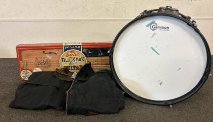 (1) Electric Blues Box Slude Guitar, (1) Gammon Percussion Snare Drum, And (1) Outback Trading Company Jacket