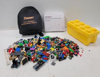 (1) Zozen Collapsible Measuring Wheel (1) Cincom Air Compression Calf Massager (1) Box of Lego