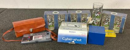 (8) Cow Glass Cups, (2) Cameras, (1) Set Of Technical Pens, And More