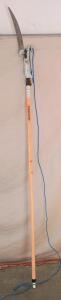 Fiskars Pole Saw, a Tool Used for Pruning High Branches. 100" Long, 160" Fully Extended