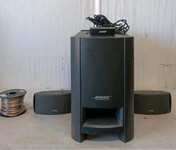 Bose home theater speaker system, specifically a Bose CineMate Series System. A Roll Of Speaker Wire
