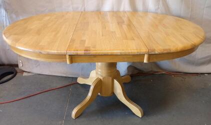 Round Oak Wood Drop-Leaf Dining Table With a Pedestal Base. (Round-42"X42"X30"H) (With Leaf-60"X42"X30H)