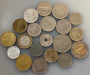 Collection Of Foreign Coins With Various Designs And Denominations