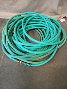 Over 100' Of Coiled Garden Hose
