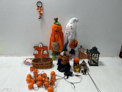 (1) tote of Halloween decorations (1) Bag of Halloween decorations.