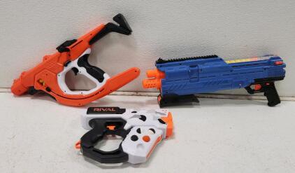 (1) Nerf Rival Heracles Xix-500 Camo Series (1) Nerf Rival Curve Shot Sideswipe XXI-1200 Blaster (1) Nerf Rival Atlas XVI-1200 Blaster